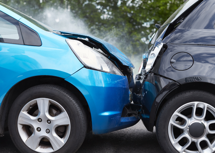 bright blue car smashed into the back of black car.