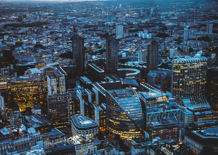 Aerial View of London England Skyline lit up at night.