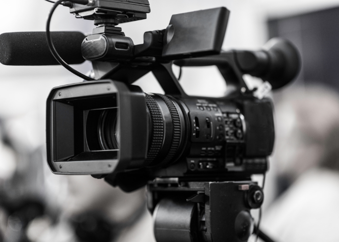 large camera recording interview.
