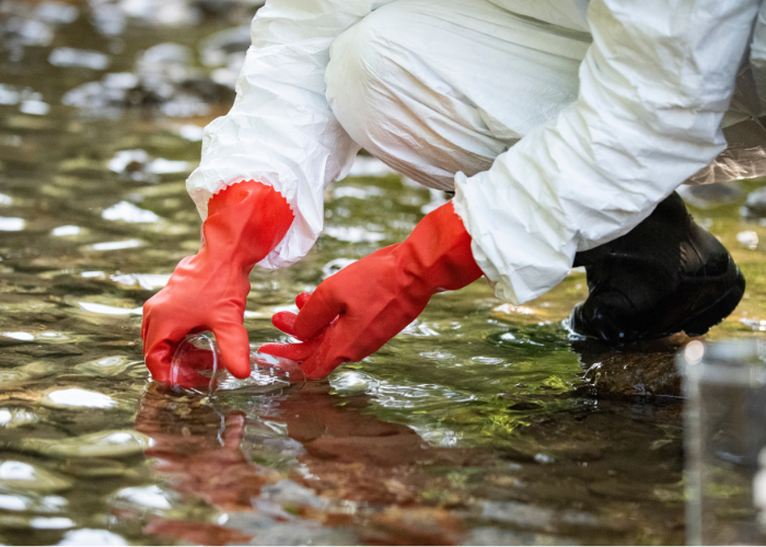 scientist testing polluted water.