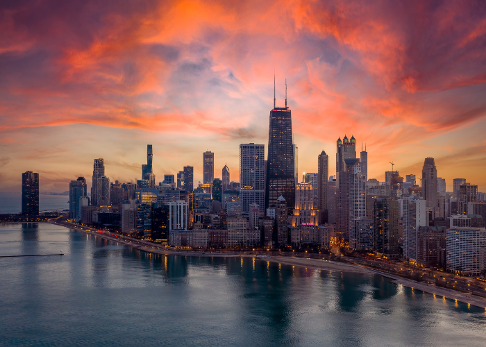 Chicago cityscape under pink sunset.