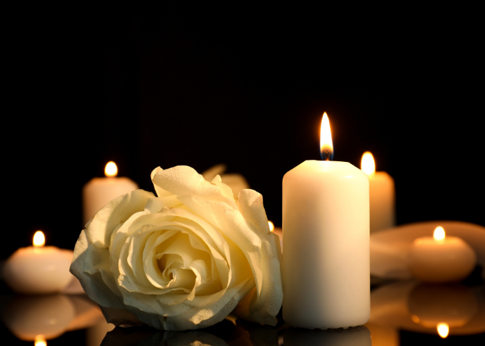white flowers and lit candles.