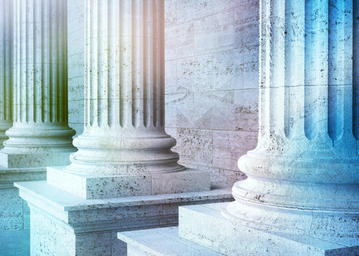 White pillars with colorful overlay.
