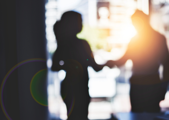 Business people shaking hands.