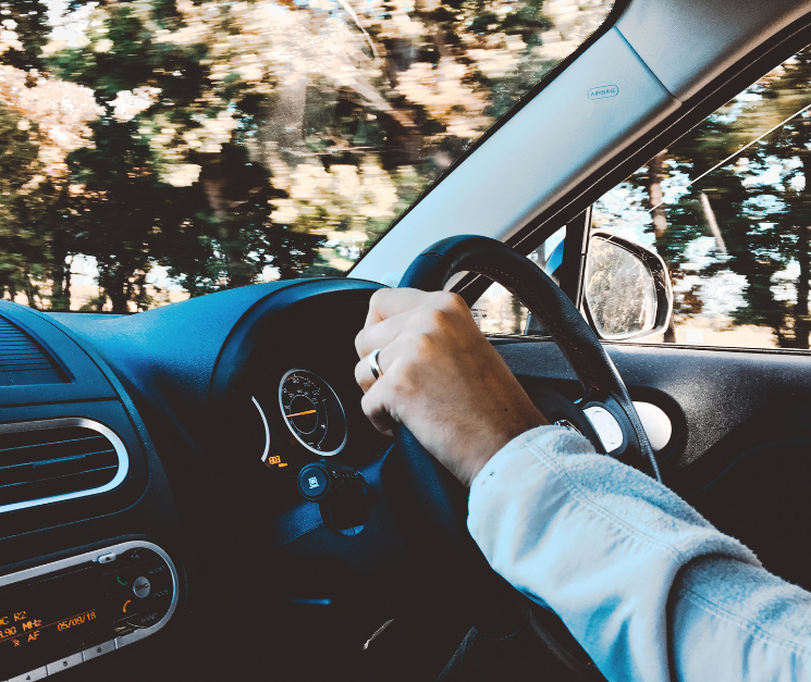 man driving car with black leather interior.