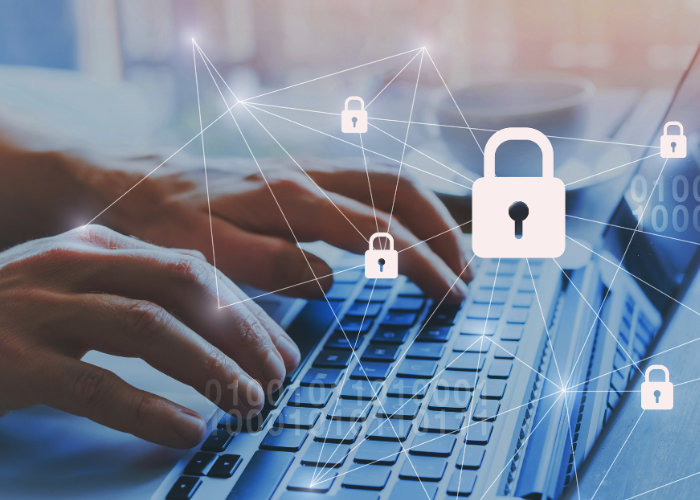typing on laptop with locked data.