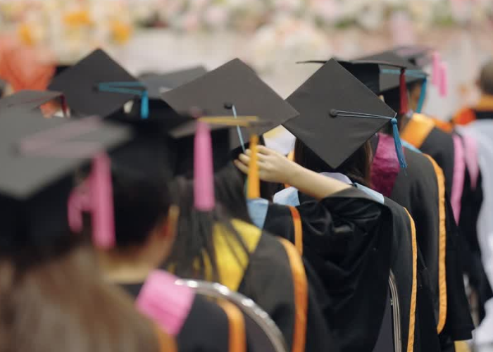 graduates at commencement ceremony.