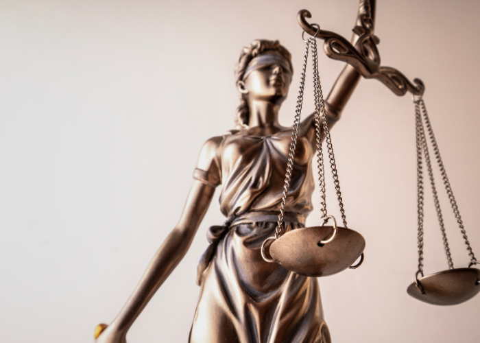 Lady justice holding justice scales.