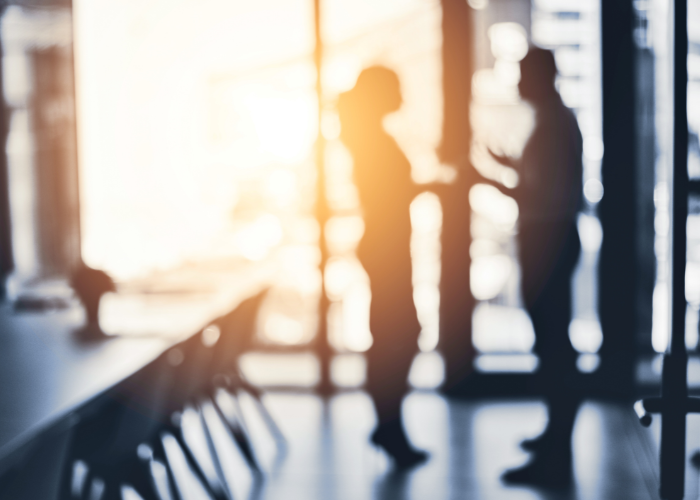 SEC Whistleblower Advocates image of senior executives chatting in conference room