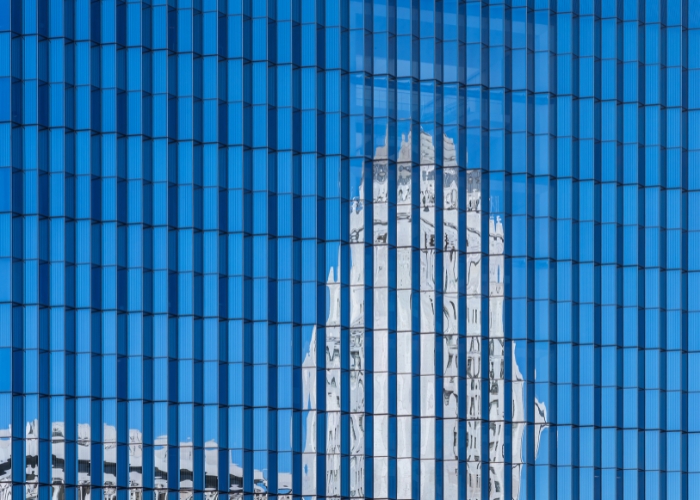 Courthouse reflected in glass window paired with a release about David Middleman joining DiCello Levitt's Mass Tort Litigation Practice Group