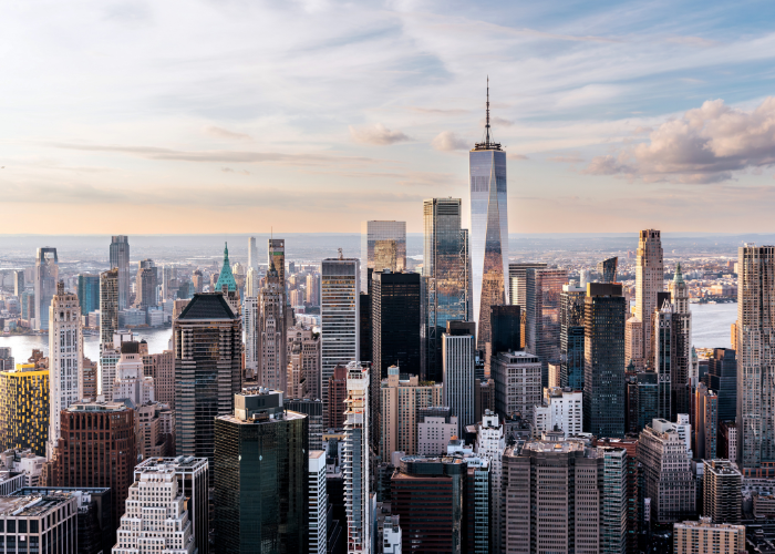 Skyline of New York City with tall skyscrapers and blue sky.