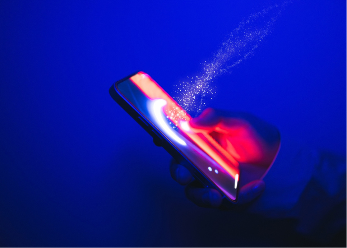Image of person touching cell phone for release: New Mexico Secures Resounding Jury Victory Against Meta in Cambridge Analytica Privacy Trial